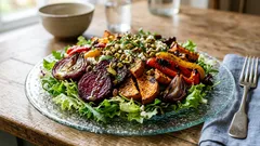 Rostade grönsaker på sallad med apelsindressing – så får du restaurangkänsla hemma